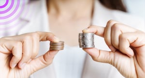 Two stacks of coins held in either hand.